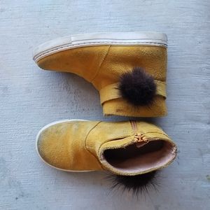 Confetti yellow suede boots with fur pom pom